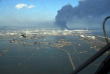 220px-SH-60B_helicopter_flies_over_Sendai